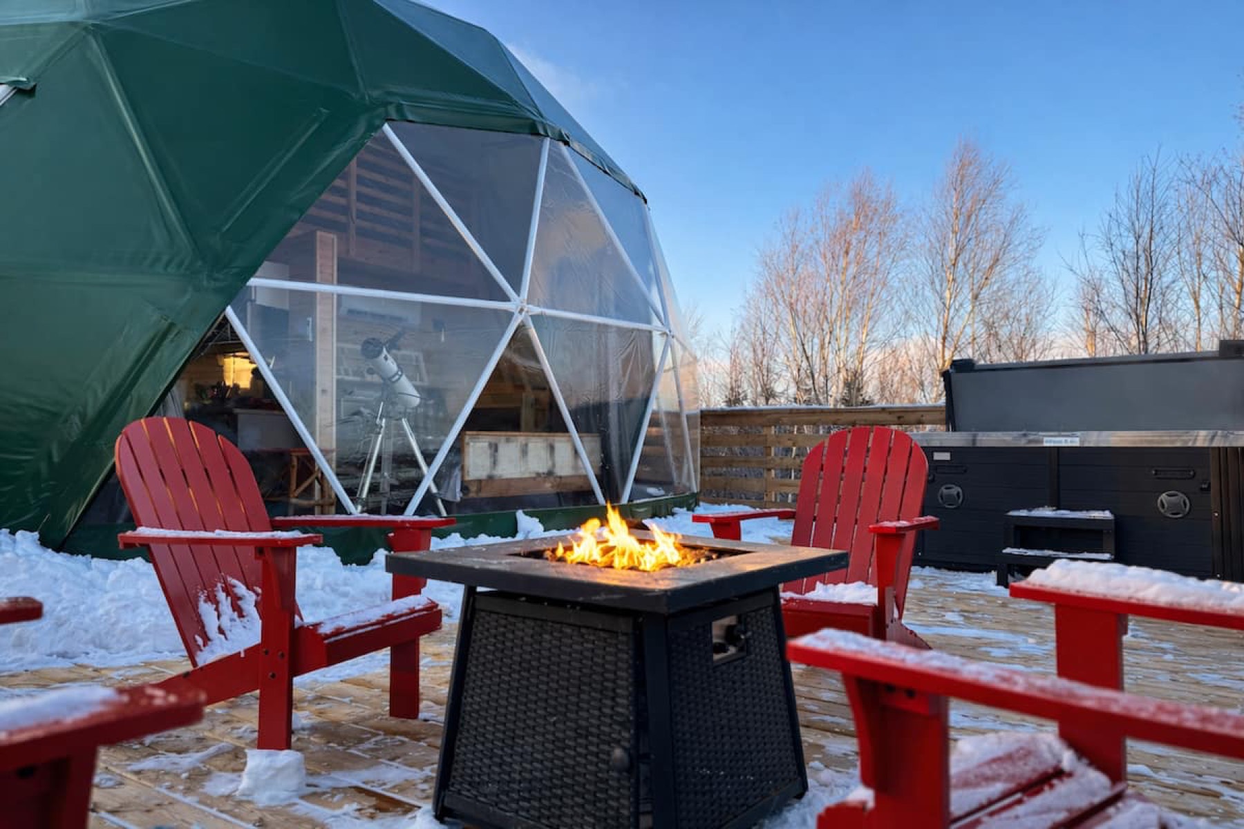 Birchwood Meadow — the private hot tub on the deck at sunset